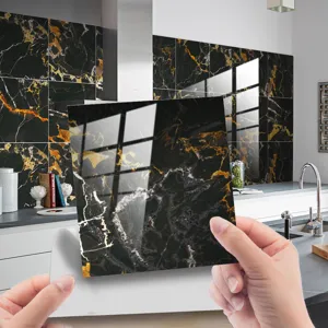 Black and gold marble tile sticker detail, waterproof self-adhesive wall tile for kitchen decor.