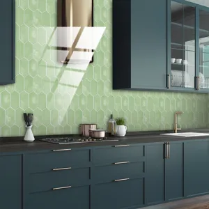 Detail shot of retro green geometric tile sticker in a modern kitchen background.