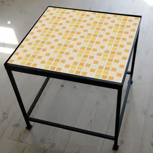 Detailed view of yellow mosaic tile sticker, self-adhesive waterproof wallpaper for kitchen.