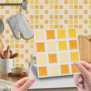 Self-adhesive mosaic tile sticker with yellow orange checkered design for kitchen decor.