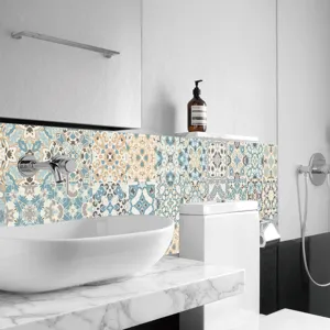 Detailed view of vintage mosaic tile stickers installed on bathroom wall, blue pattern.