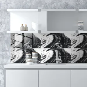 Close-up view of modern black and white marble pattern tile sticker kitchen backsplash decor.