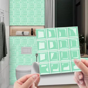 Close-up view of 3D mosaic tile sticker in green, self-adhesive DIY wall decor for bathroom.