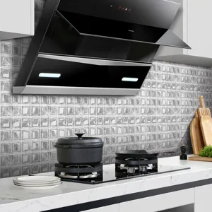 Close up of 3d mosaic tile sticker showing textured marble pattern on kitchen wall surface.