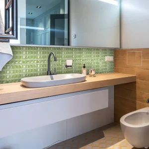 Green 3D mosaic tile sticker detail, waterproof self-adhesive PVC wall decor for bathroom.