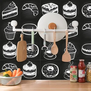 Kitchen detail shot featuring retro chalk drawing style tile stickers with dessert patterns.