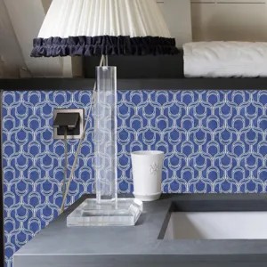 Close-up scene of blue mosaic wall sticker in bathroom, waterproof DIY PVC decorative wallpaper.