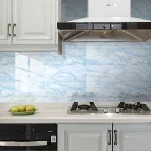 Kitchen wall detail featuring blue marble pattern tile sticker, waterproof and glossy decor.
