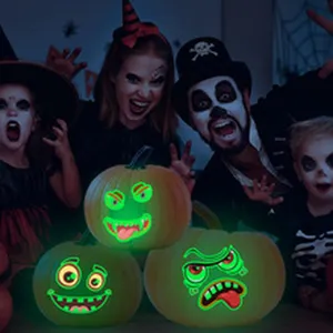 Halloween glowing pumpkin decorations with spooky faces, perfect for party ambiance.