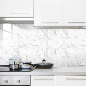 Close-up kitchen interior scene showcasing white marble texture wall tile stickers design.