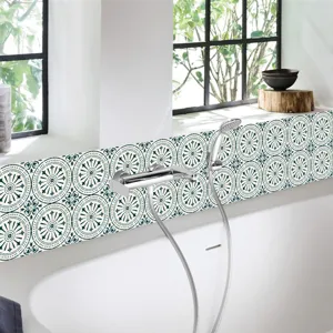 Detailed view of blue retro tile stickers, waterproof self-adhesive PVC wall decor for bathroom.