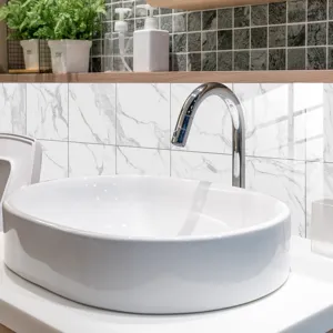 Marble texture tile sticker detail in modern bathroom decor, waterproof surface finish.
