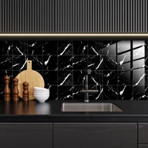 Black marble tile sticker detail shot showing modern kitchen wall decoration and self-adhesive design.