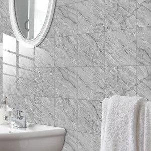 Grey marble effect tile sticker detail, self-adhesive wall paper for modern bathroom decor.