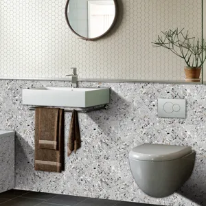 Detail view of terrazzo pattern wall sticker in modern bathroom scene for interior decor.