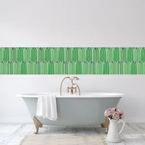 Detailed view of green peacock feather pattern wall tile sticker in a modern bathroom scene.