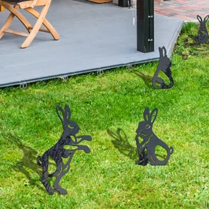 Outdoor garden silhouette yard stake in grass, decorative black acrylic animal art for lawn.
