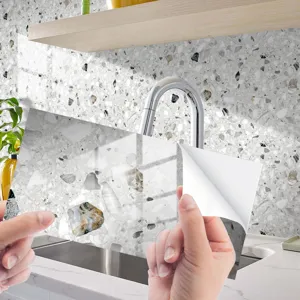 Terrazzo pattern crystal film self-adhesive tile sticker for kitchen wall and floor decor.