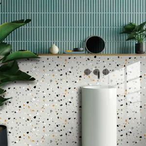Interior detail view showing terrazzo pattern wall sticker applied in a modern bathroom setup.