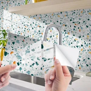Terrazzo pattern crystal film tile sticker detail shot showing self-adhesive backing peel.