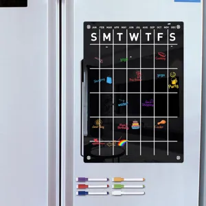 Clear acrylic magnetic calendar board for fridge with dry erase markers for easy planning.
