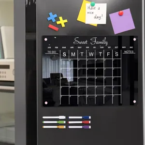Clear acrylic magnetic calendar memo board detail view showing weekly schedule and erasable markers.