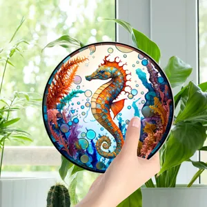 Close-up detail of colorful seahorse decorative hanging plaque in bright indoor setting.