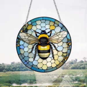 Detailed shot of stained glass bumblebee hanging ornament, colorful honeycomb wall decor.