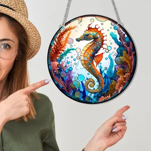 Colorful seahorse circular hanging wall decor with chain, vibrant ocean art ornament for home.