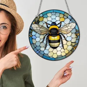 Close up detail of the stained glass style bumblebee hanging wall decor with metal chain.