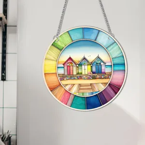 Close-up detail of the colorful beach hut circular hanging wall decor with vibrant tones.