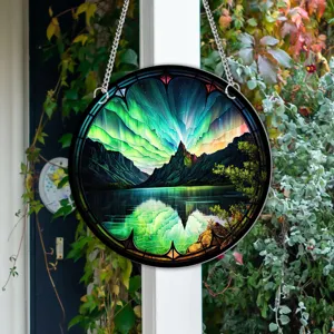 Stunning round hanging decor featuring vibrant aurora borealis, mountain and lake scenery.