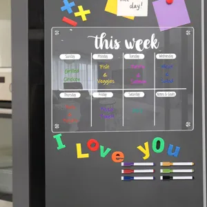 Clear acrylic weekly planner magnetic board for fridge with dry erase markers and letter magnets.