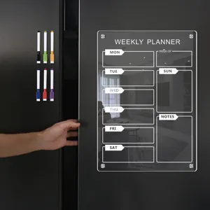 Clear acrylic magnetic weekly planner board for refrigerator with dry erase markers.
