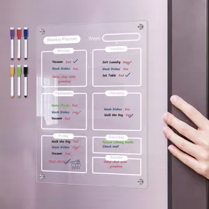 Clear acrylic weekly planner board detail showing magnetic fridge attachment and colorful markers.