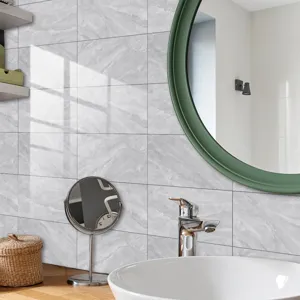 Detail shot of marble pattern crystal film tile stickers applied on modern bathroom wall.