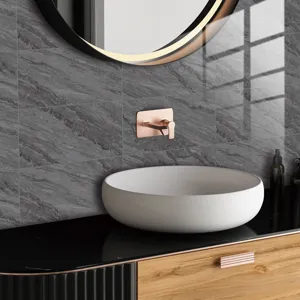 Modern bathroom detail with gray faux marble wall tile sticker and elegant gold faucet basin.