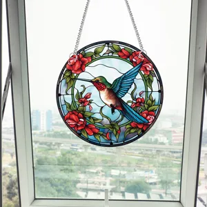 Stained glass hummingbird window hanging detail showing vibrant colors and intricate metal chain setup.
