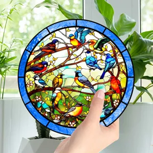 Round stained glass bird window hanging, colorful tree branch design, detailed close-up view.