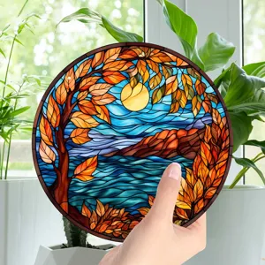 Detailed close-up view of a circular stained glass autumn landscape wall decor piece.
