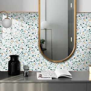 Detailed view of terrazzo pattern wall sticker in modern home interior scene with decor.