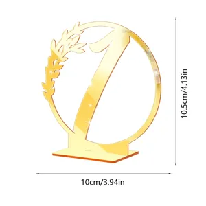 Gold mirror acrylic table number one sign with leaf wreath design for wedding reception decor.
