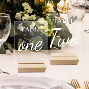 Clear acrylic table numbers with wooden base for wedding party decoration signs.