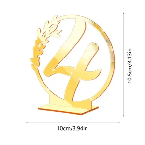 Gold acrylic table number 4 sign with floral wreath design, perfect for wedding party decor.