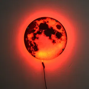 Detailed view of the glowing red moon LED wall lamp, creative night light lighting effect.