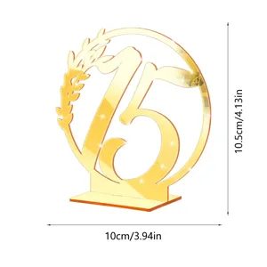 Detailed view of golden acrylic table number 15 with elegant mirror finish and leaf design.