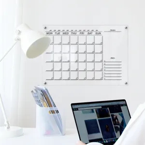 Clear acrylic monthly calendar wall planner board for home and office organization.