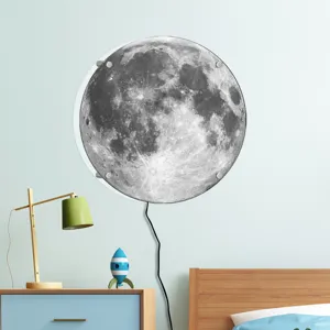 Detail view of the round moon wall lamp mounted in a cozy bedroom scene with warm lighting.