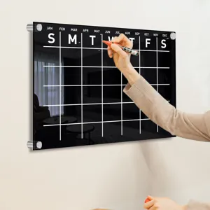 Clear acrylic wall calendar monthly erasable memo board for home and office organization use.