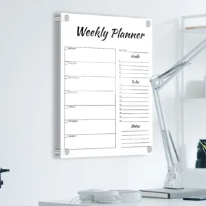 Detail view of transparent acrylic weekly planner board, dry erase message board for wall.